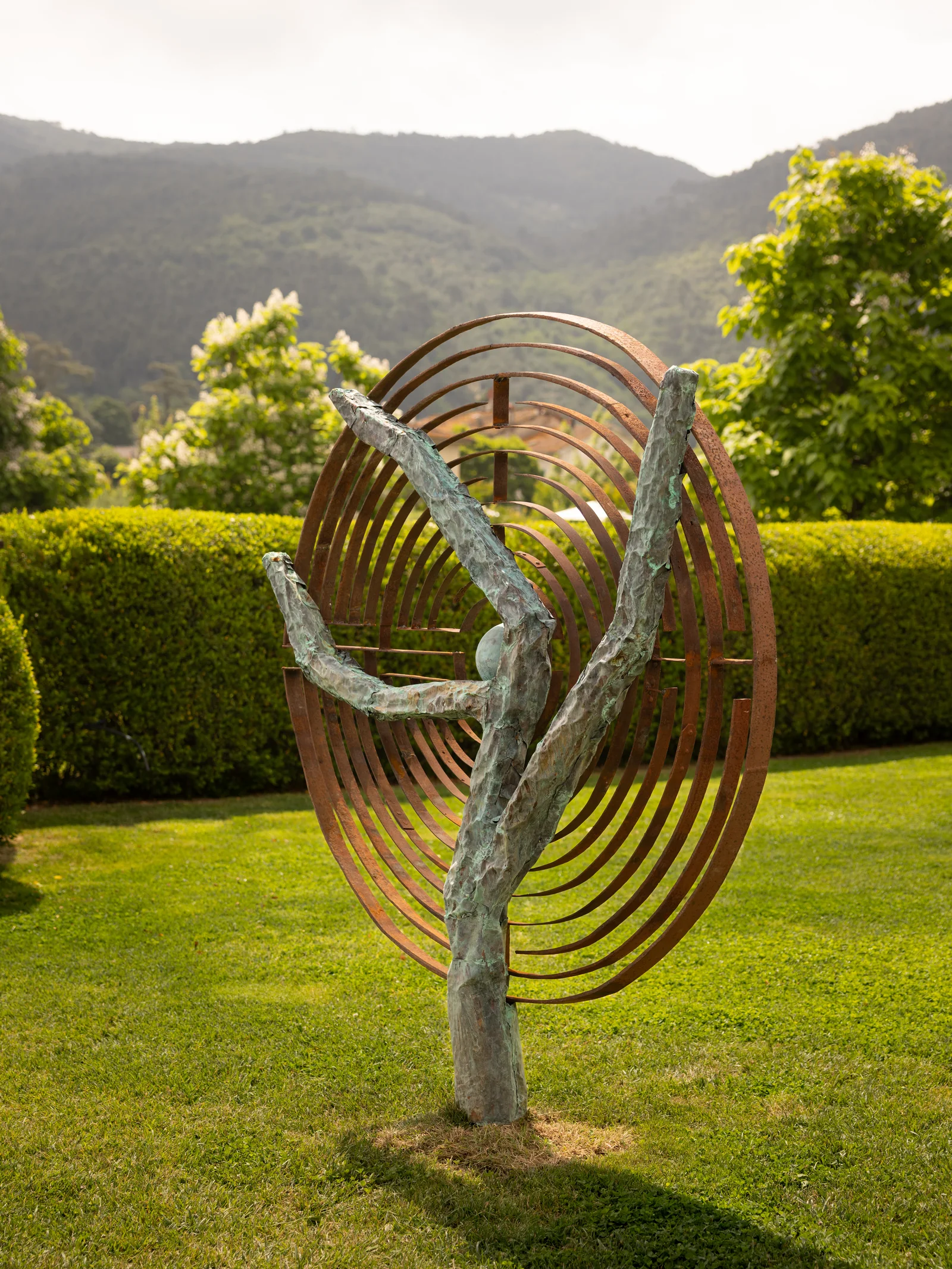 Circular contemporary sculpture overlooking the Tuscan hills at Villa Marie